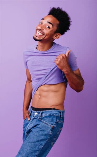 A happy gay man using a free gay chat